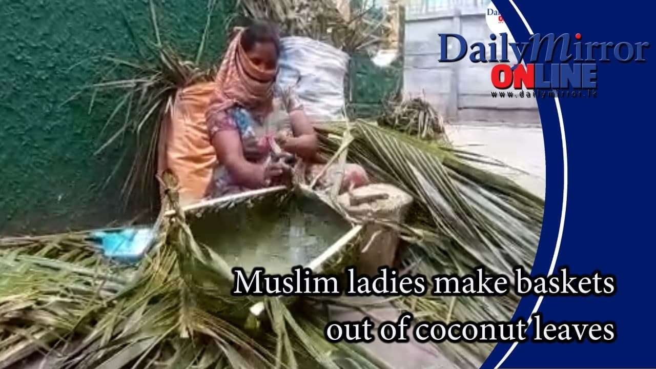 Muslim ladies make baskets out of coconut leaves