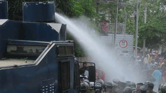Police use water cannons to disperse protesting university students:12 arrested