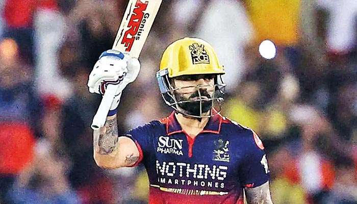 Kohli slams brilliant 105 as RCB reaches top