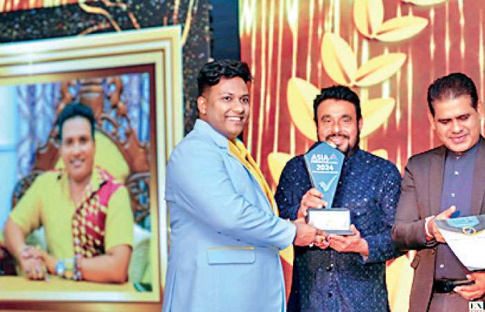 Astrologer awarded at Miracle Asia Awards ceremony