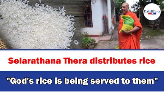 Selarathana Thera distributes rice ’’God’s rice is being served to them’’