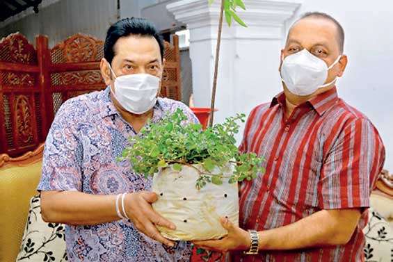 PM hands over a plant to Environment Minister