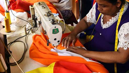 Stitching Buddhist flags...