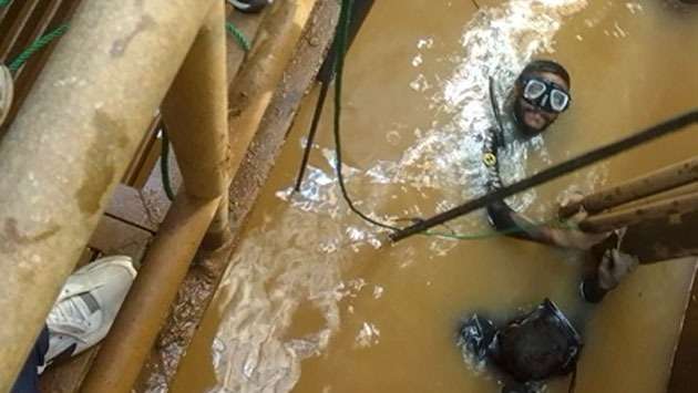 Navy divers repair flood-damaged water plants
