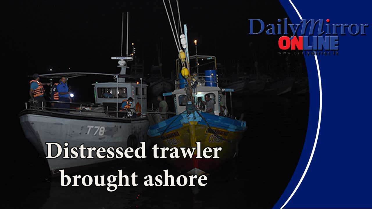 Distressed trawler brought ashore