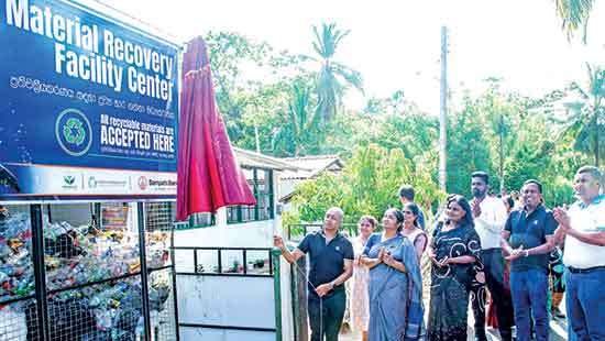 Sampath Bank hands over Dickwella material recovery facility