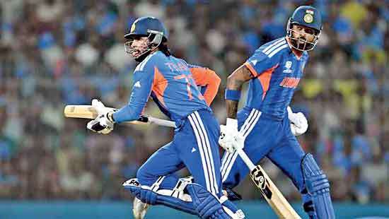 India beat Zimbabwe to keep title defence alive