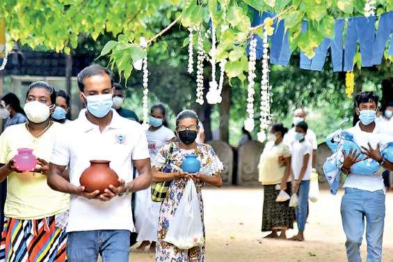 Buddhist devotees pay homage at Kelaniya Temple