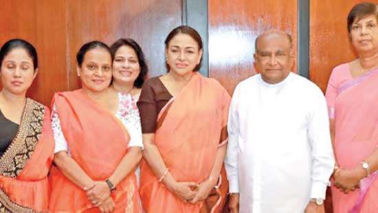 18-day global campaign on violence against women  Women MPs clad in orange sarees in Parliament yesterday