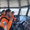 Indonesia rescuers battle turbulent seas in search for 129 people after passenger ship capsizes