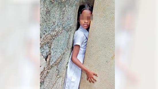 School girl trapped between two walls rescued