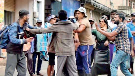 Clash between estate labourers, two arrested