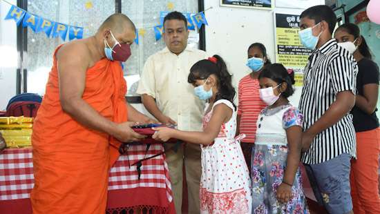 School children get stationery...