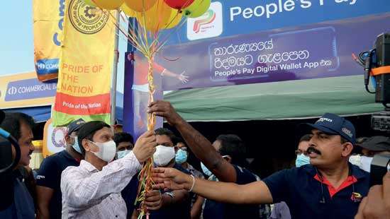 People’s Bank promotes LankaQR facility in Negombo