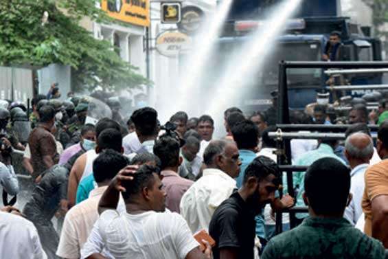 Police use tear gas and water cannons to disperse protesters