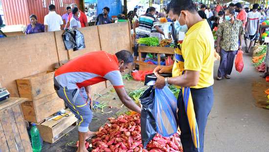 People busy buying expensive veggies...