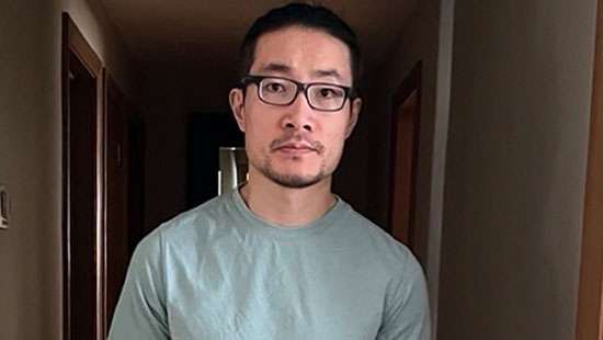 Chinese national who exposed rights abuses is freed from US detention after being granted asylum