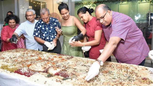 Christmas cake-mixing event held...