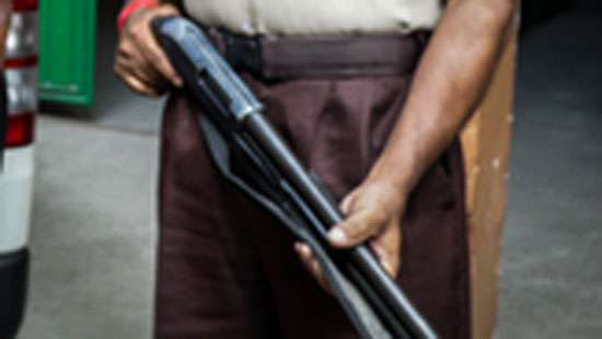 Firearm of state bank security discharged injuring female employee