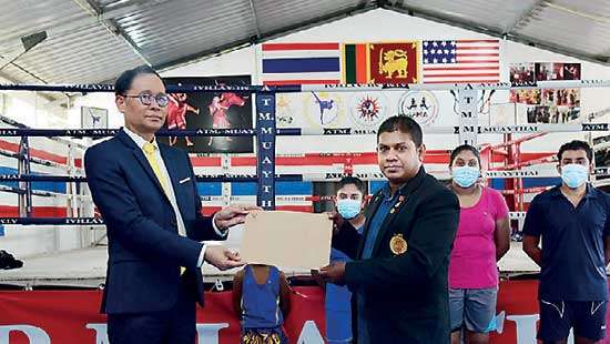 Thai envoy hands over donation to Muay-Thai Association