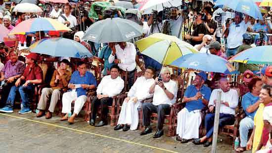 Sheltered under different umbrellas