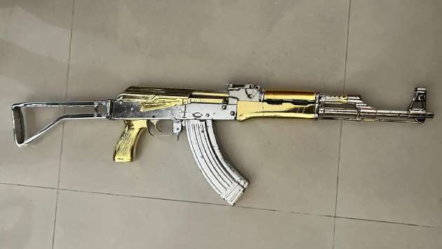 Gold-coloured firearm found in Colombo apartment complex