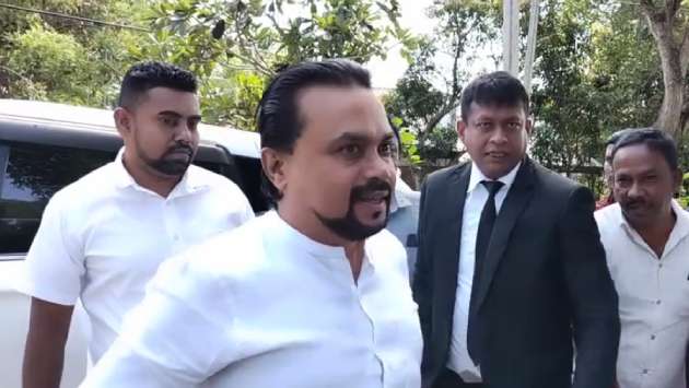 Wimal Weerawansa arrives at Tangalle police