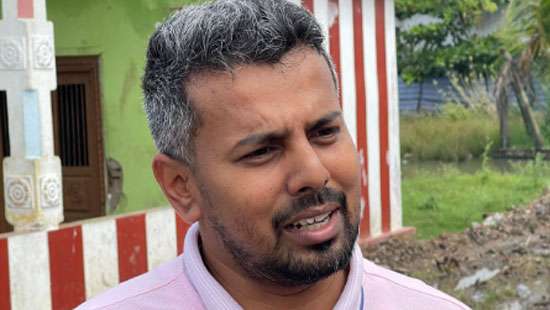 Cassilingam calls for digitization of Jaffna Library