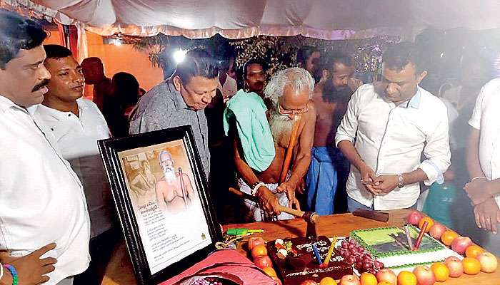 Vedda chief cuts birthday cake with axe