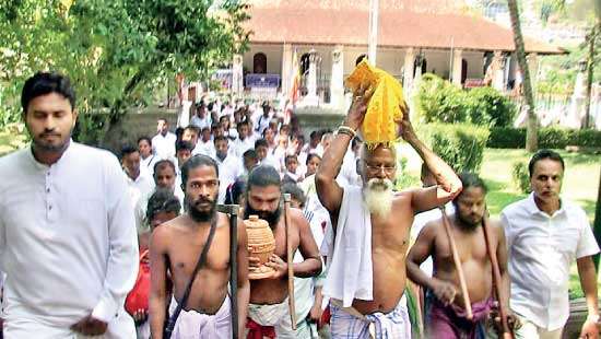 Vedda Community perform offering bees honey to the Sacred Tooth Relic