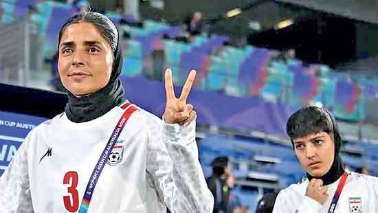 Iran’s women decline national anthem