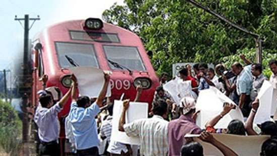 Protestors block Matara train: demand bamboo gates back