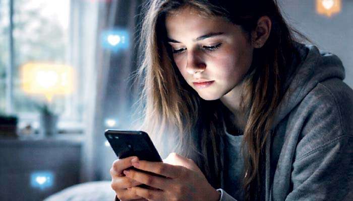 Heavy social media use linked to falling youth happiness: Report