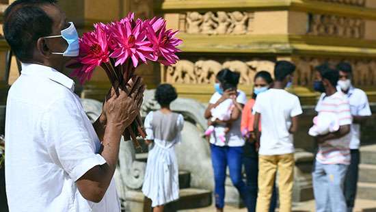 Observing Medin Poya Day