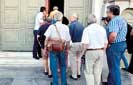 Banks reopen, taxes hiked as Greece seeks to reboot economy