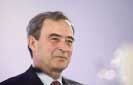 Lafarge chief gets 2.5mn euro merger bonus as cement company cuts jobs