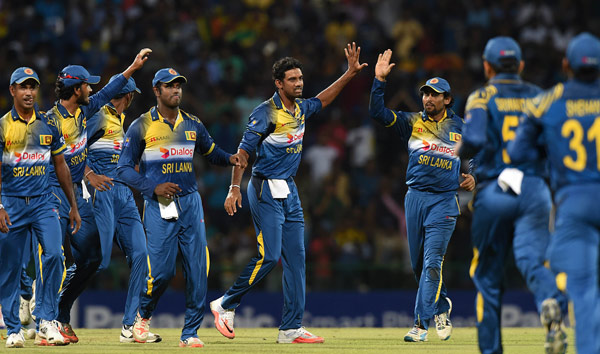 Senanayake celebrates with team mates