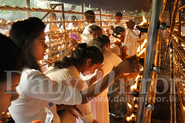 Seeking blessings on Esala Poya day 