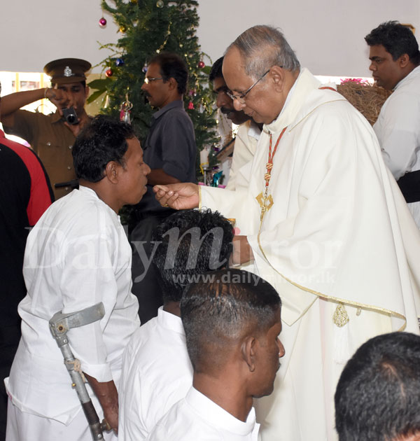 Cardinal with inmates