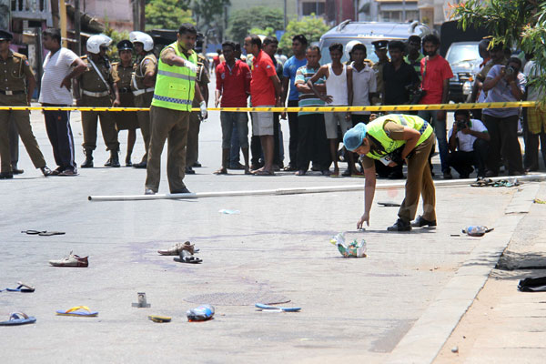 Police inspecting Kotahena crime scene