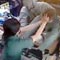 Video: Lankan female cashier pulls robber by his hair