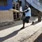 Three youth bowled playing cricket on the road