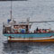 Lankan tamil refugees arrive by illegal boat service, one held