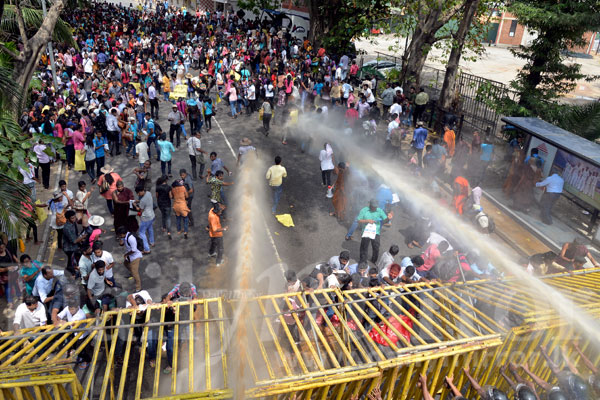 Video: Police fire tear gas at protesters