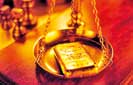 Gold strikes highest in almost three week, boosted by rate outlook