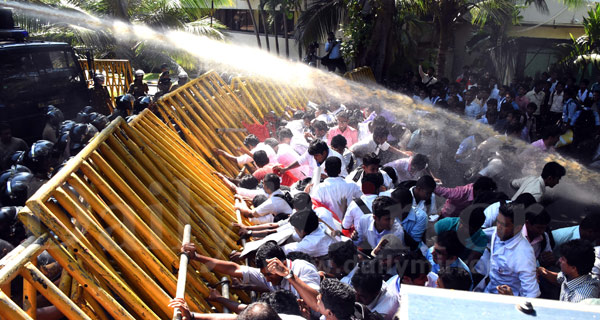 Video: Police fire tear gas to disperse protesting students