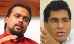 Wimal hits out at Mervyn's mask