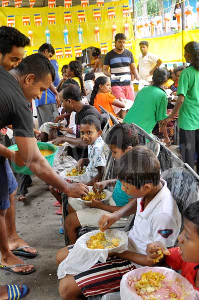 Sharing meals on Vesak