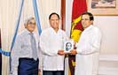 Amunugama presents his book to president