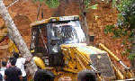 Man buried under mound of earth